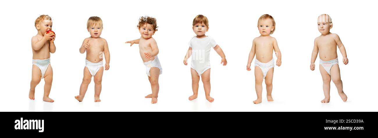 Standing babies, some holding objects, one eating apple, others looking ...