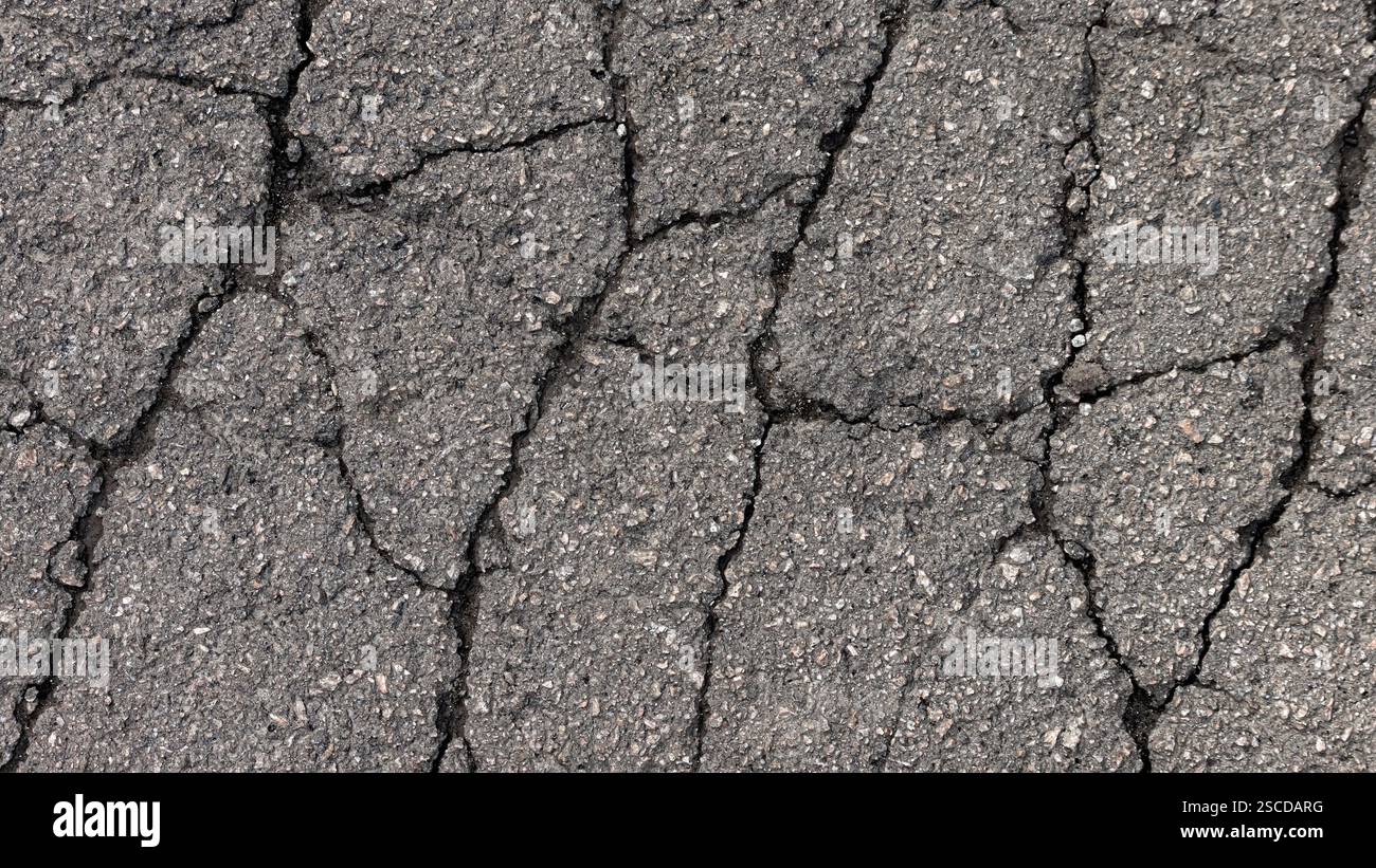 Cracks in specialized road surface. Structured, background image Stock Photo