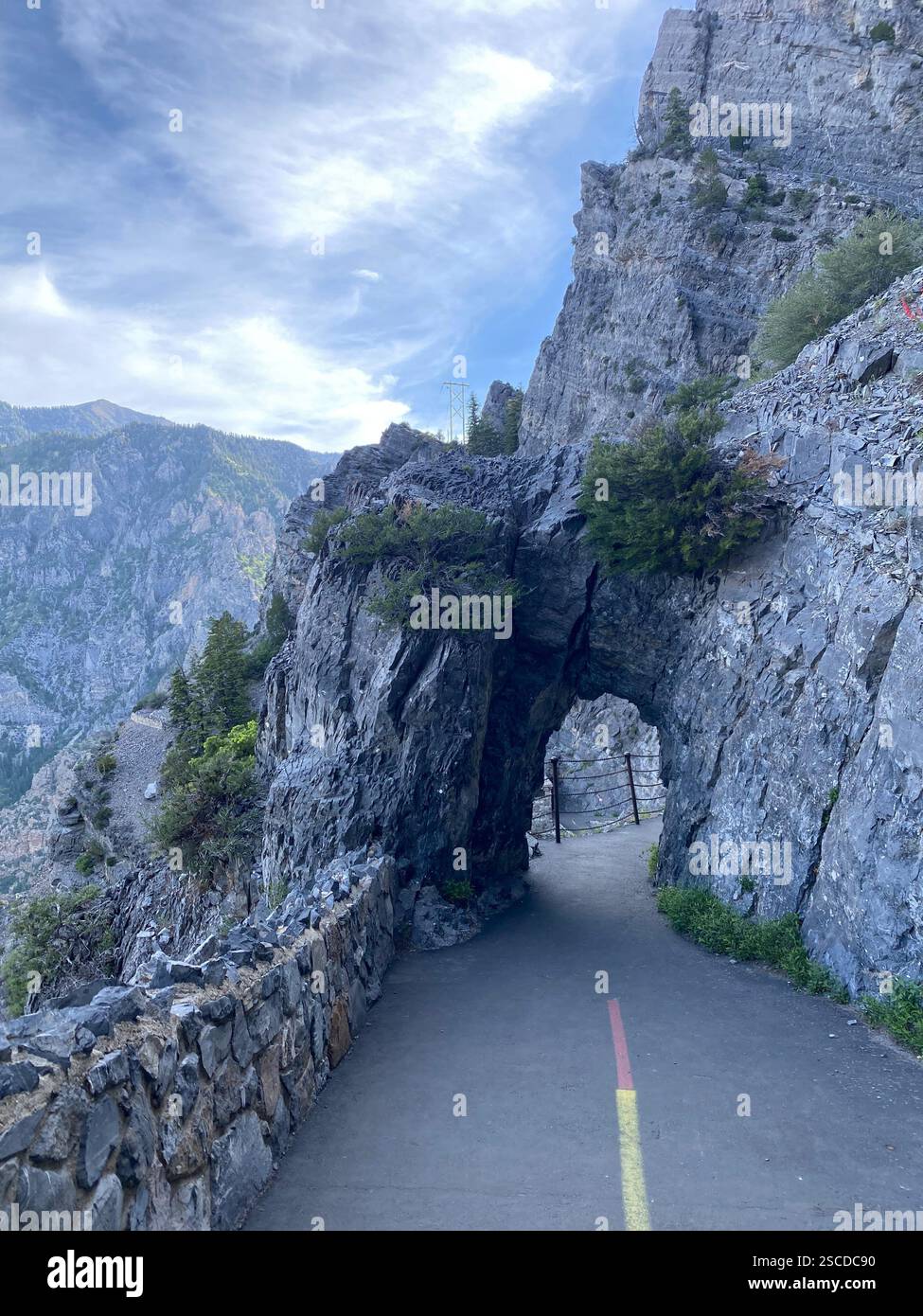 Arched path through rocky mountain side - Smartphone Captured Stock Image