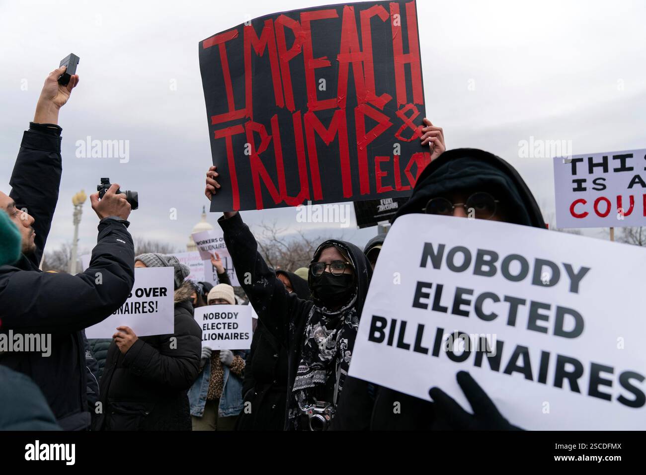 FILE - People protest against Elon Musk outside the U.S. Department of ...