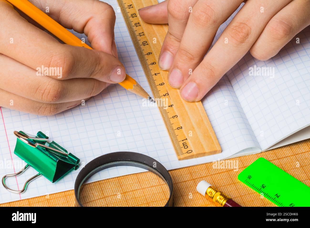 draftsman draws on a ruler on the graph paper Stock Photo - Alamy