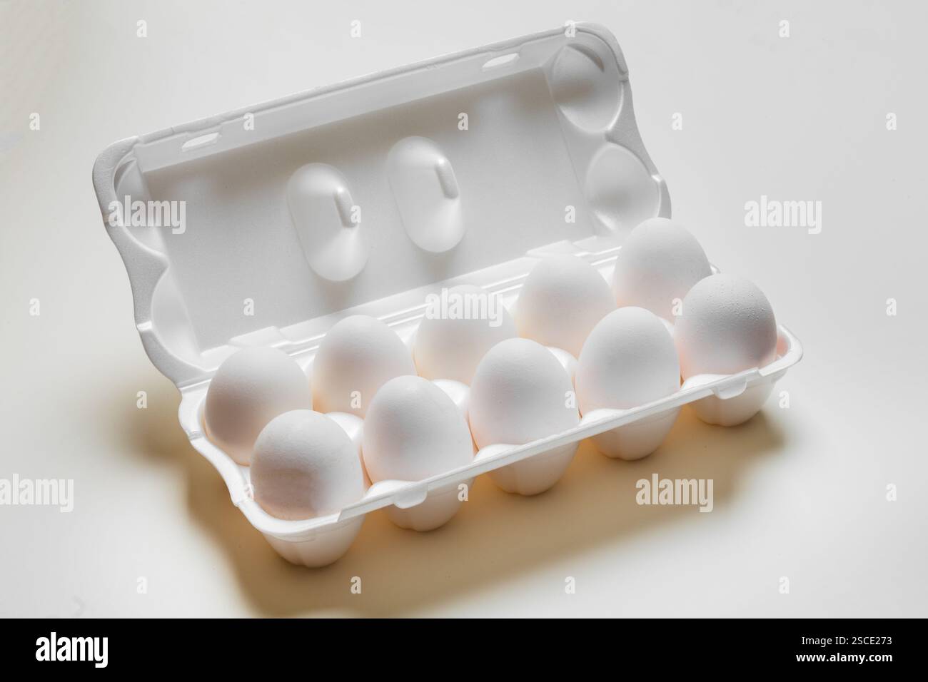Chicken eggs in the cassette box on a white background Stock Photo - Alamy