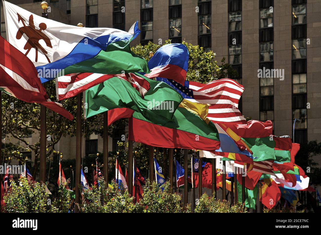 International waving flags at the Rockefeller Centre, New York City, USA, North America Stock Photo