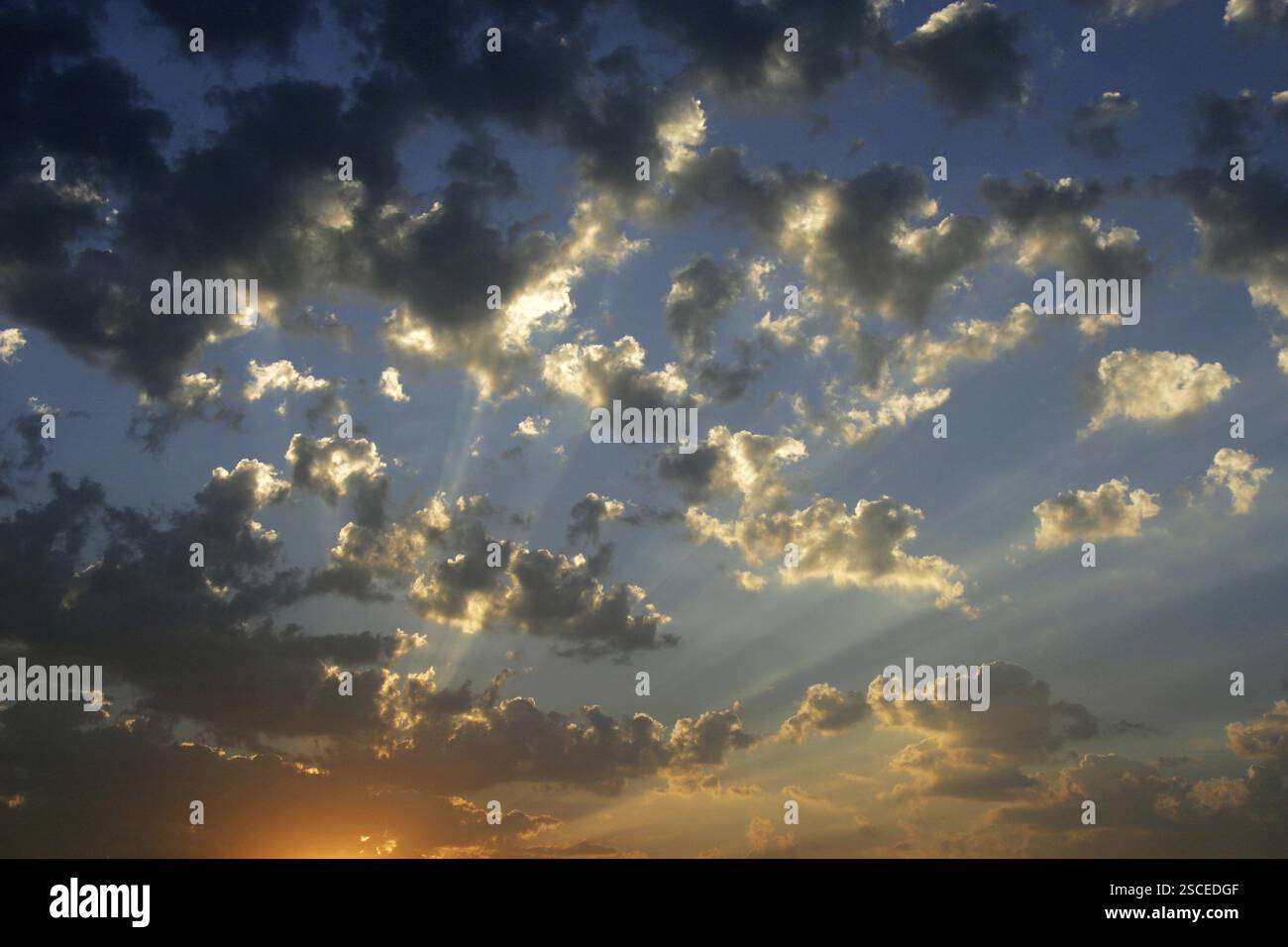 Fluffy clouds with blue skies and rays of sun, Pune, Maharashtra, India ...