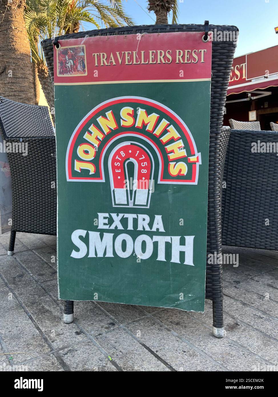 John Smith's Extra Smooth sign outside a British Pub called The Travellers Rest in Playa de las Américas. Arona, Tenerife, Canary Islands, Spain. - Smartphone Captured Stock Image