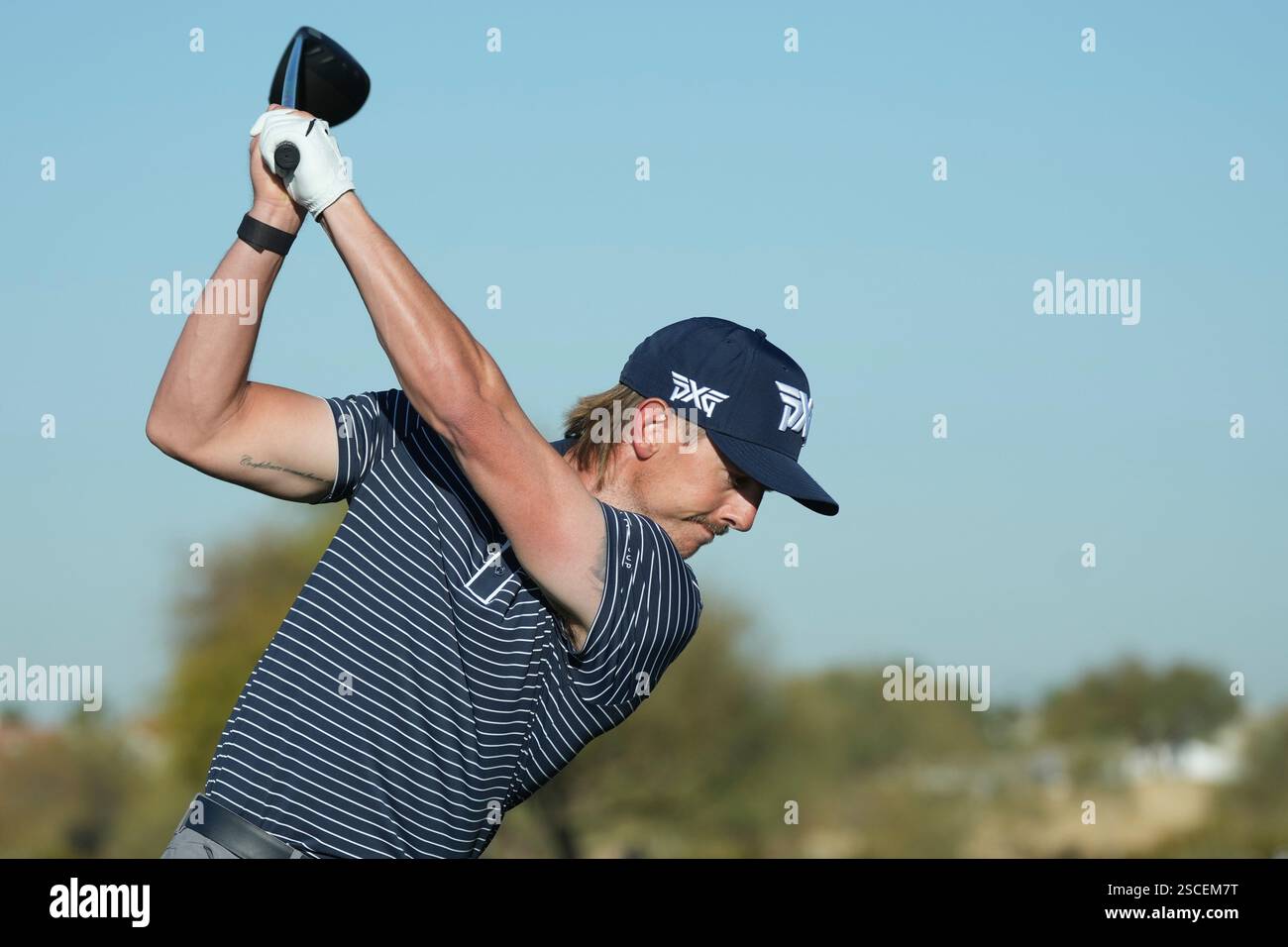 Jake Knapp his his tee shot on the 13th hole during the first round of