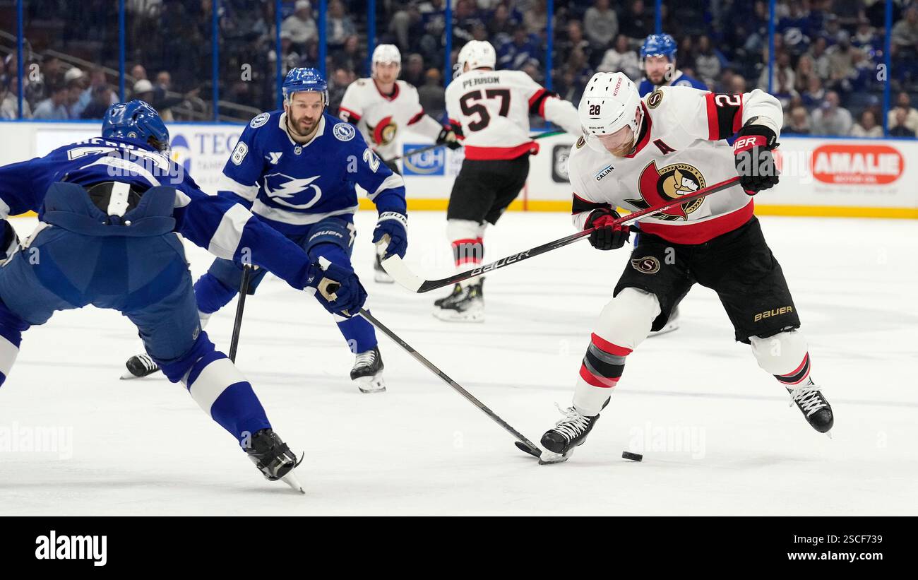Ottawa Senators right wing Claude Giroux (28) cuts between Tampa Bay ...