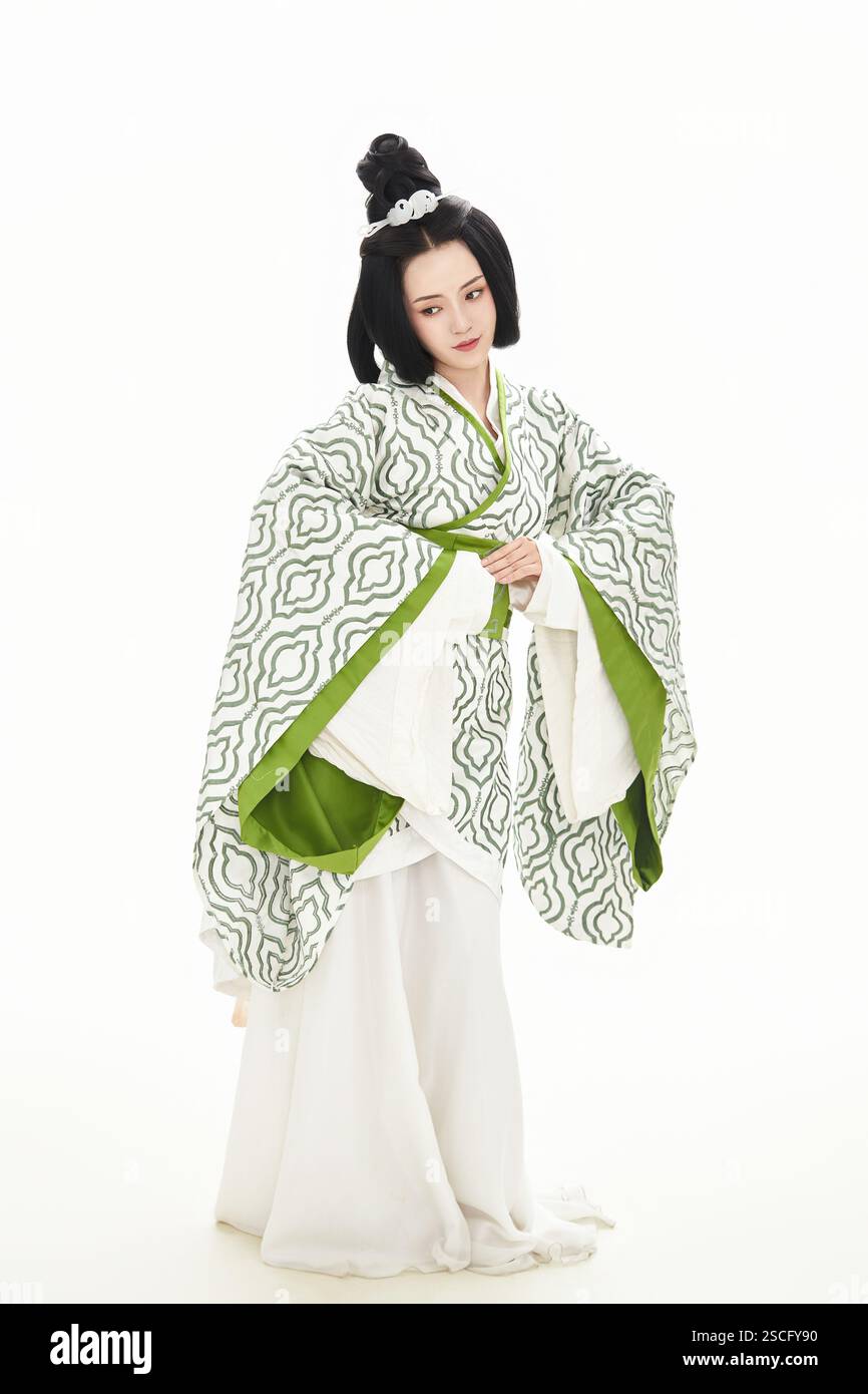 Teenage girl dressed in Chinese Han Dynasty costume on white background ...