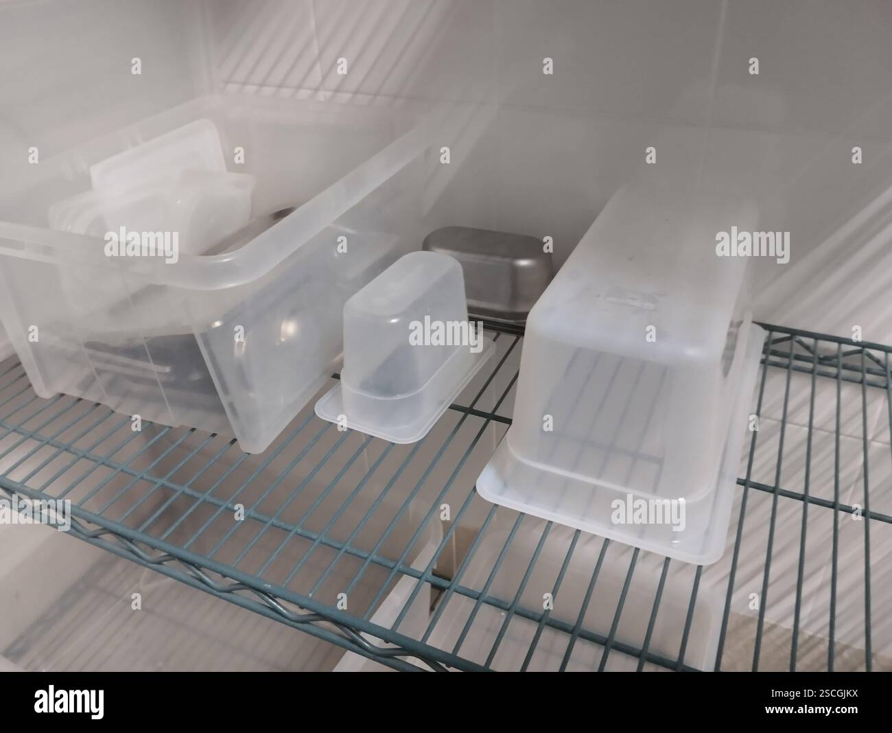plastic containers on the shelf. Stock Photo