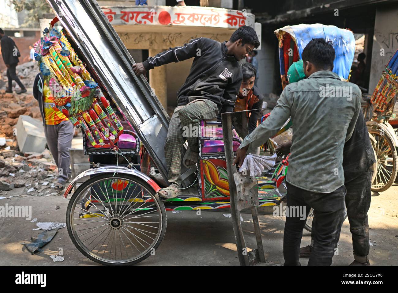 Sheikh Reksha People carry metal and other reusable materials on a rickshaw taken ...