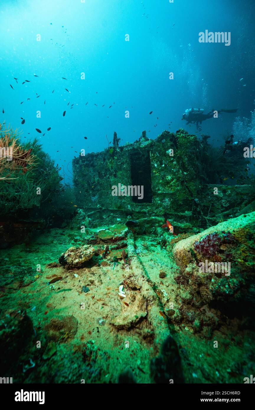 diver exploring wreck of an old fishing vessel in the Maldives Stock ...