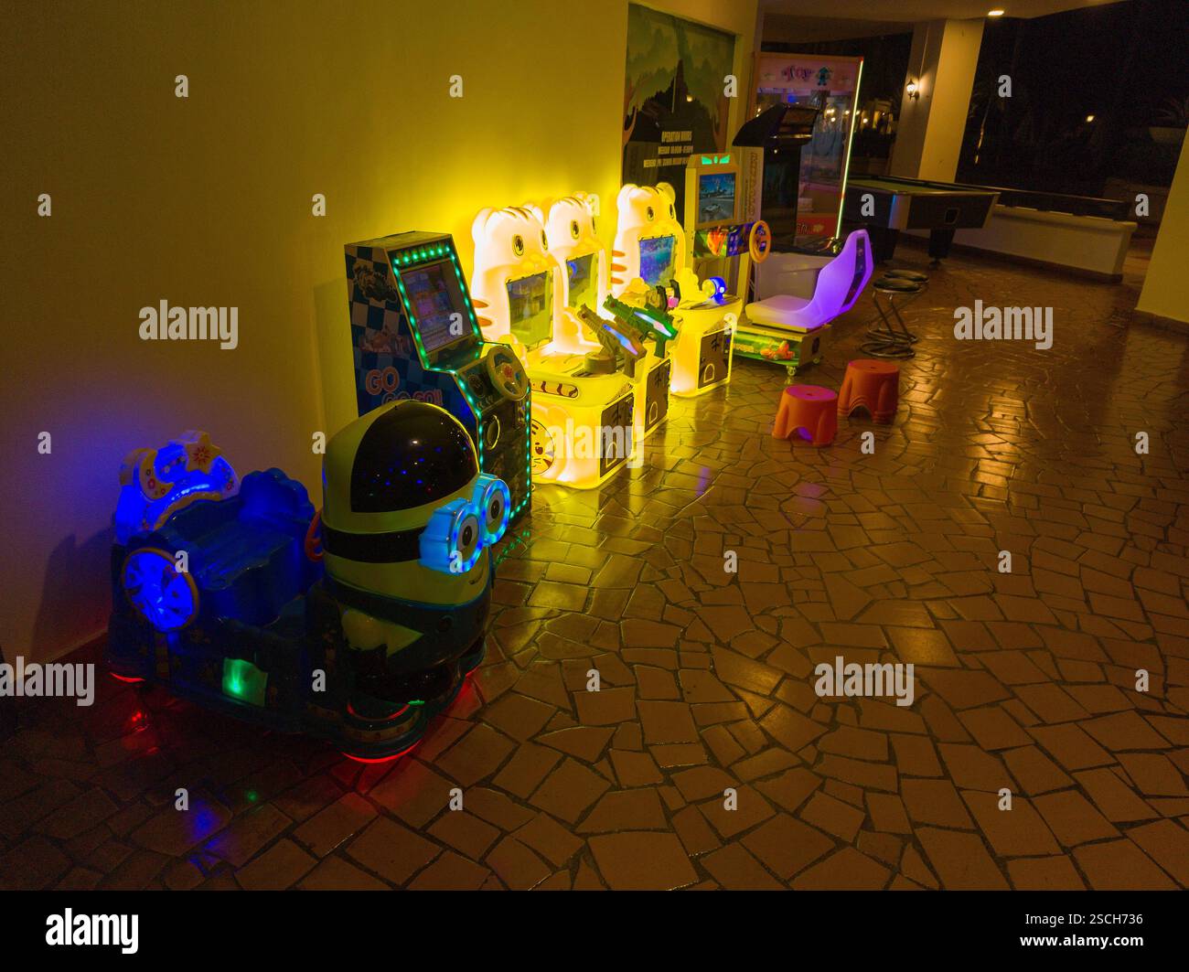 Children's electronic toy games, brightly lit in evening light Stock Photo