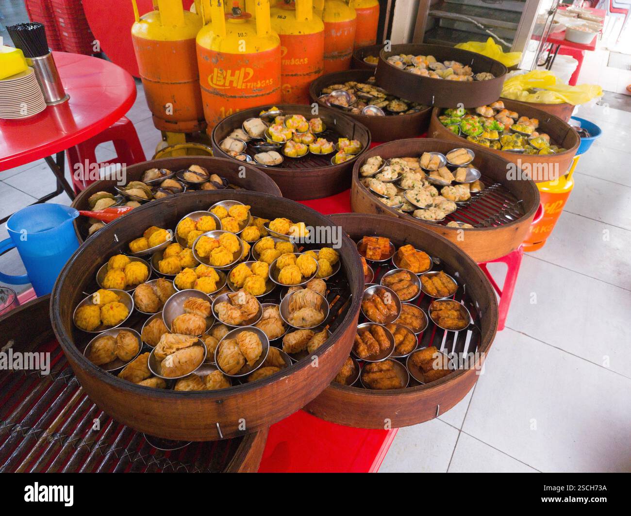 Chinese dim sum delicacies in steamer baskets, varied selections ...