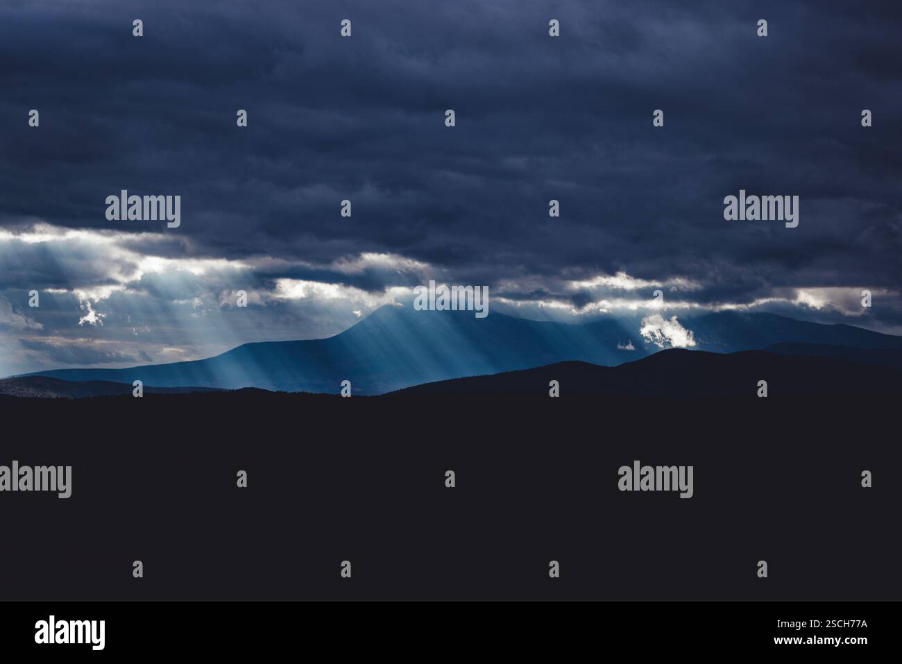 Sunbeams break through clouds over Katahdin, Maine Stock Photo