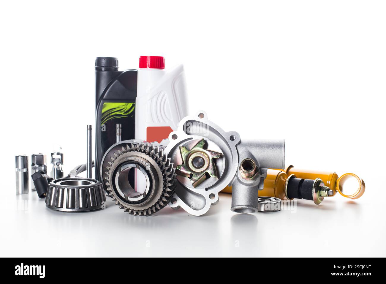 Various automotive components and tools arranged on a white background ...