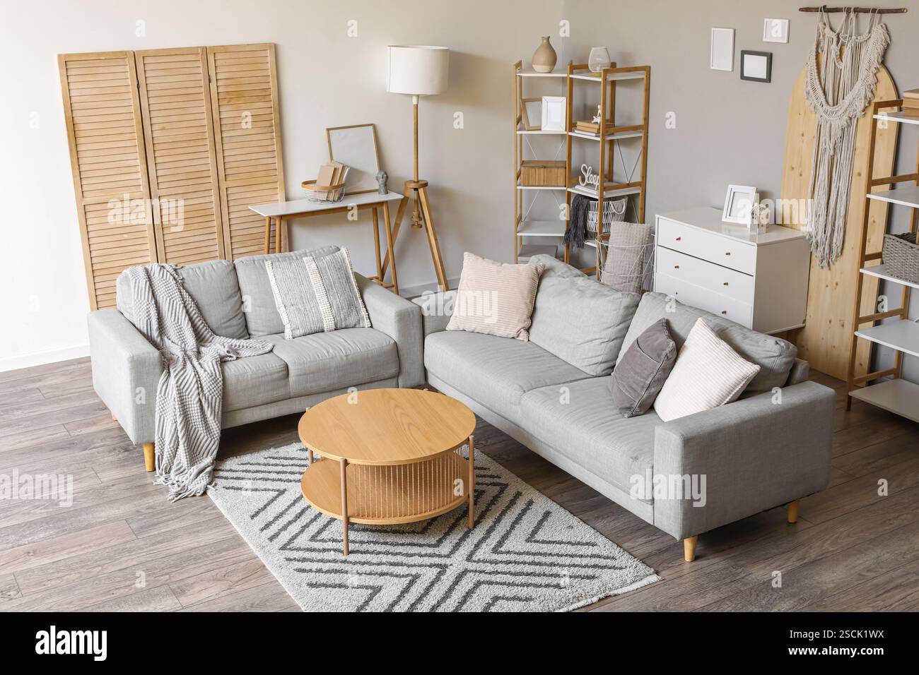 Cozy sofas and coffee table in interior of living room Stock Photo - Alamy
