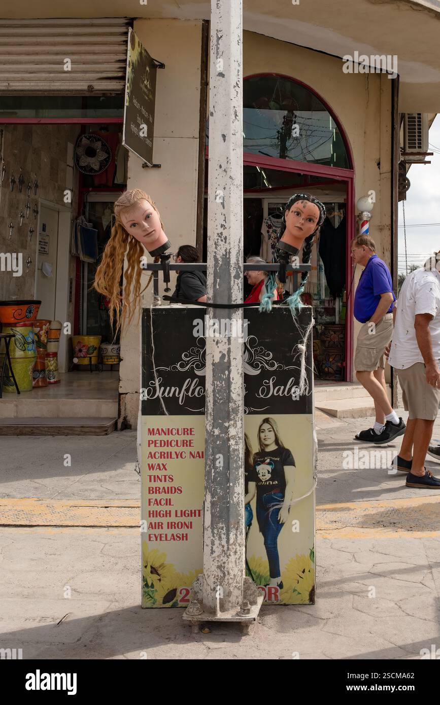Mannequin Signs Mannequin head with hair on a sign advertising the Sunflower Salon in ...
