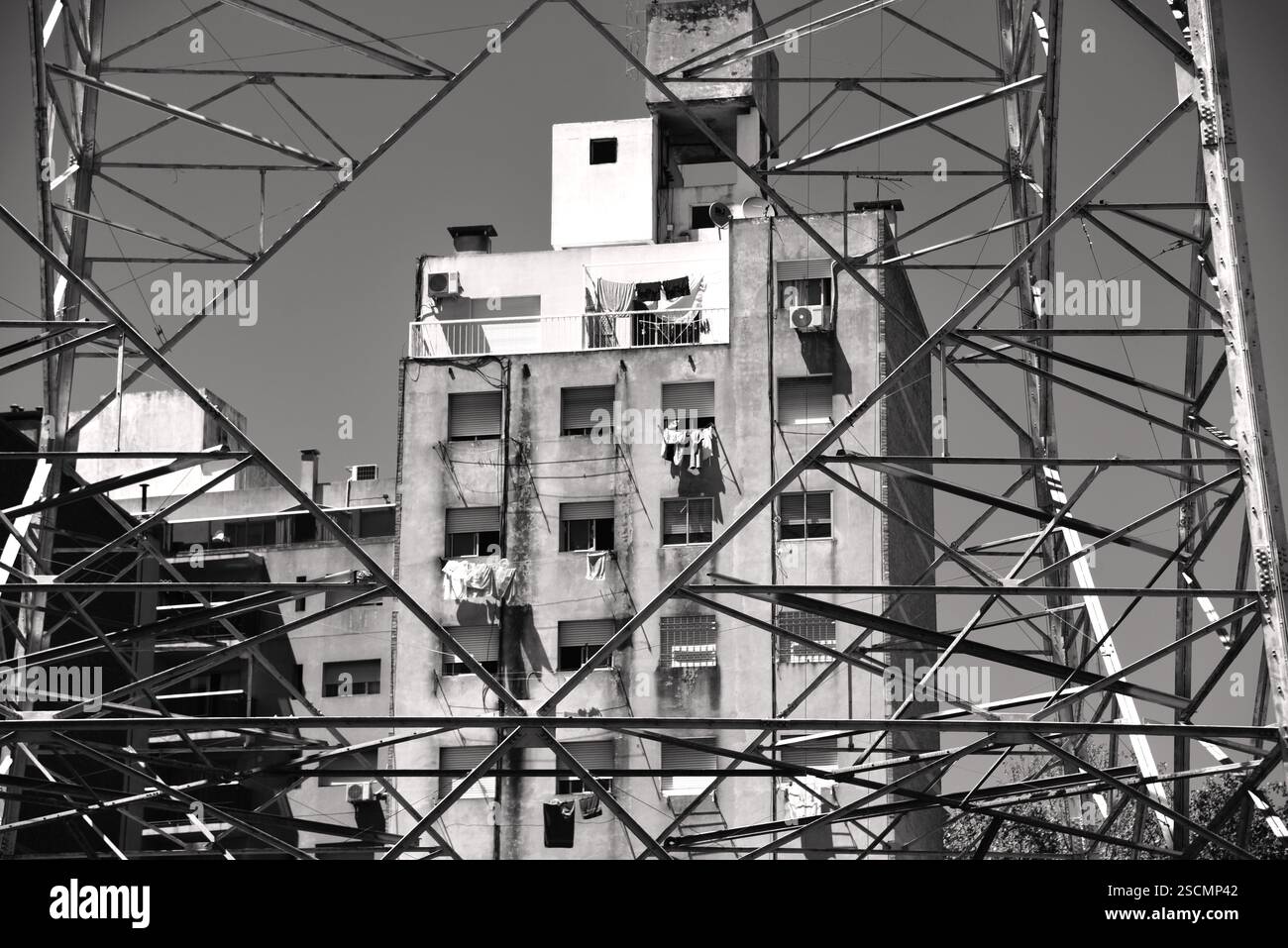 Old high rise with metal tower in front monochrome Stock Photo