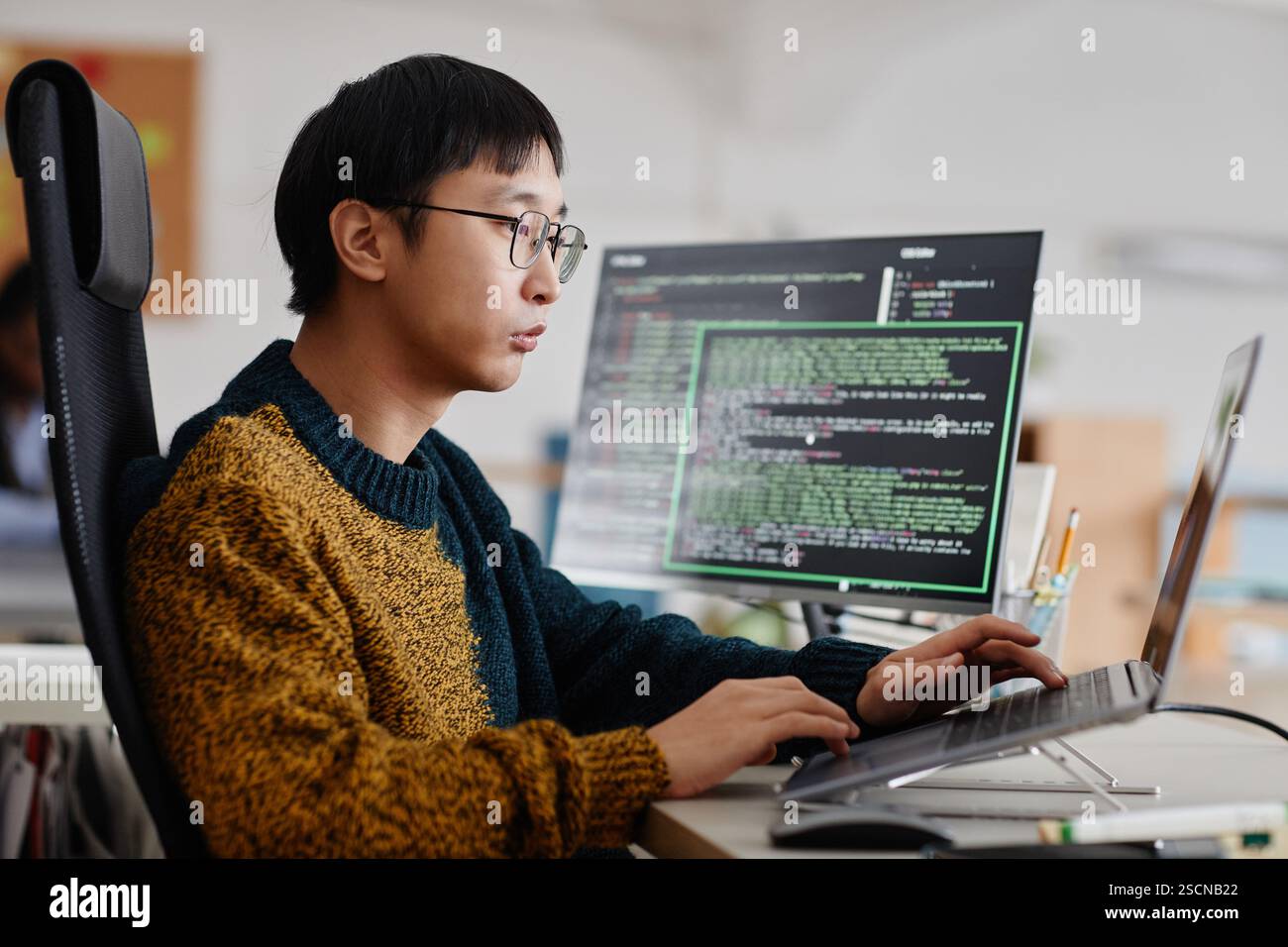 Man writing codes wearing glasses hi-res stock photography and images ...