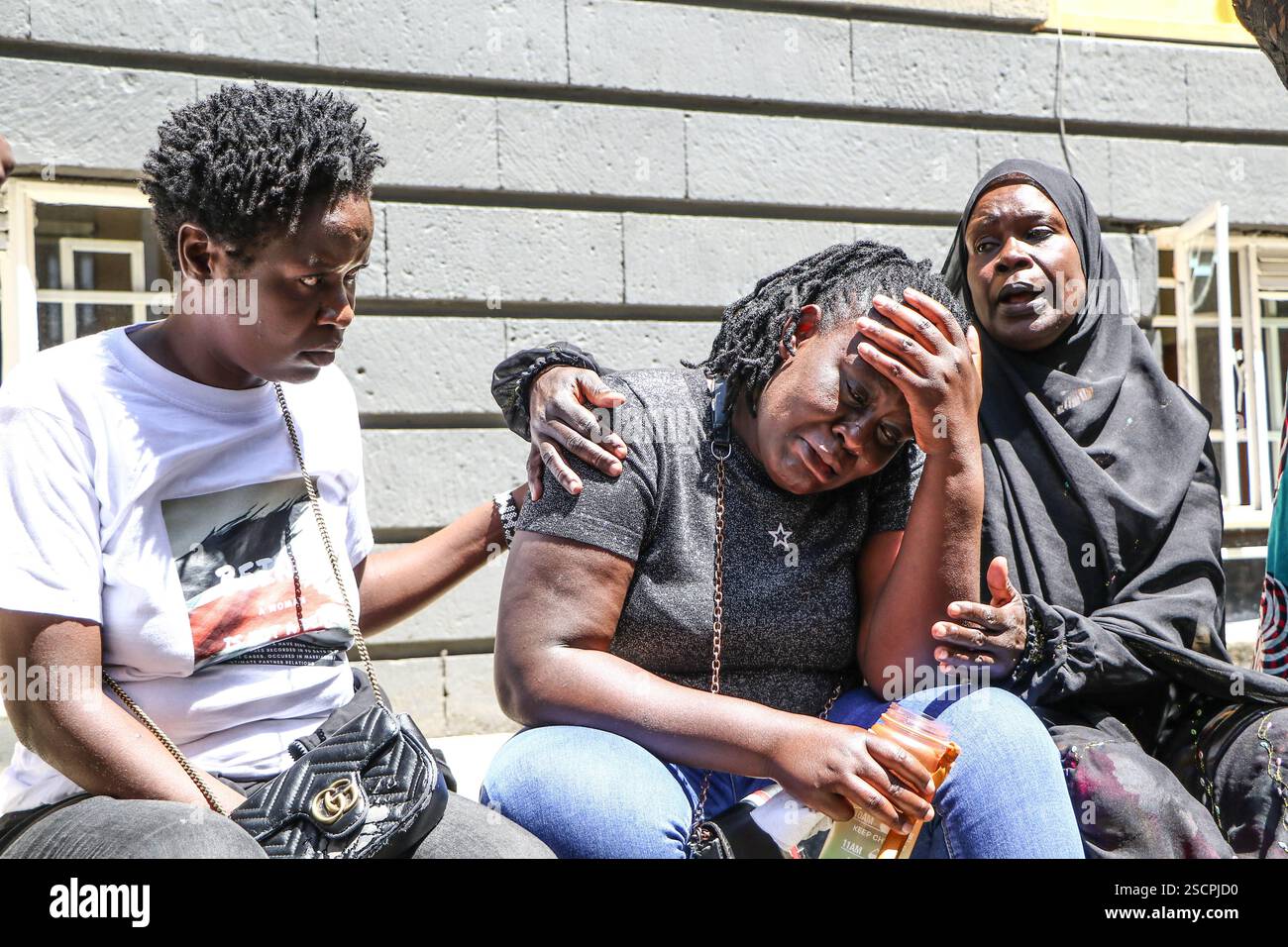 February 6, 2025, Nakuru, Kenya Alvy Okello (C) wife of missing