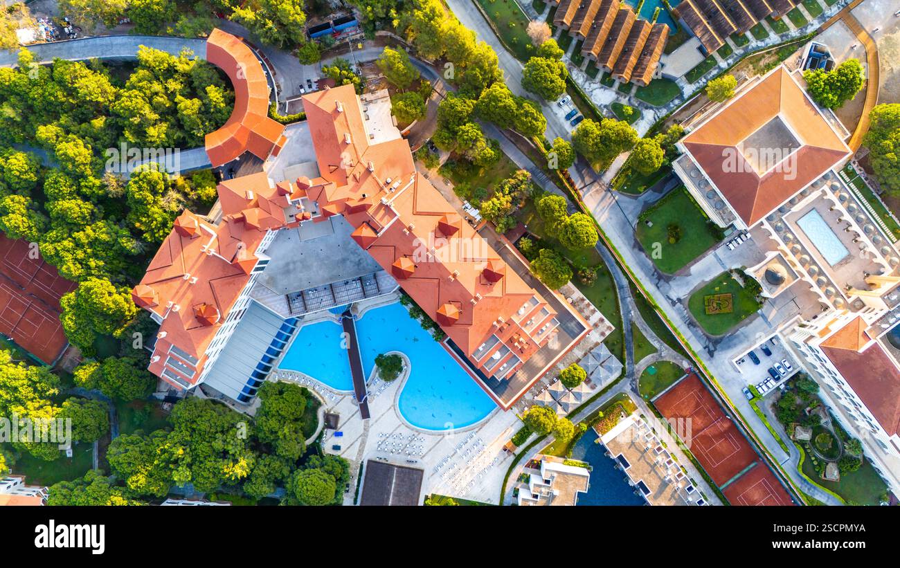 Aerial view of a luxury resort with elegant architecture, pools, and ...