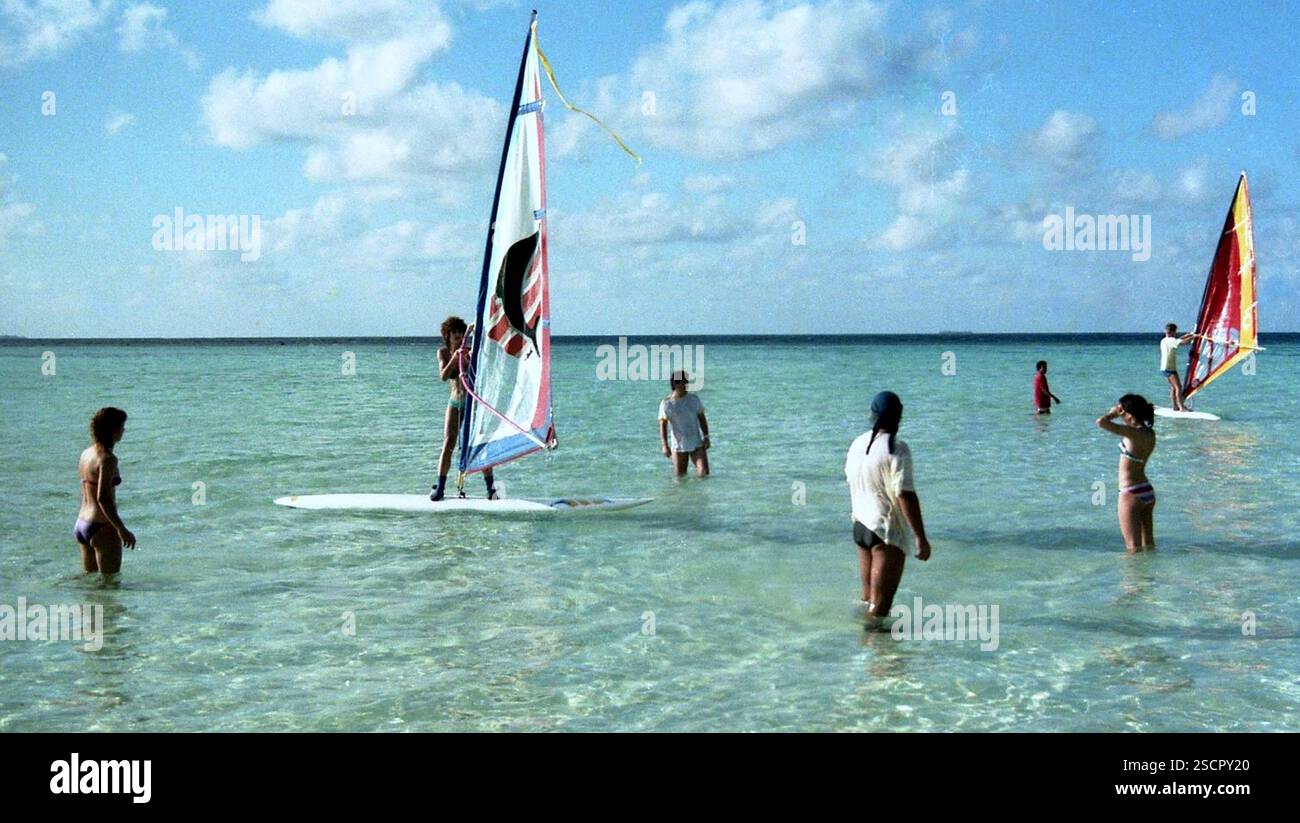 A group of tourists take windsurfing lessons at a surf school in the Maldives. [automated translation] Stock Photo
