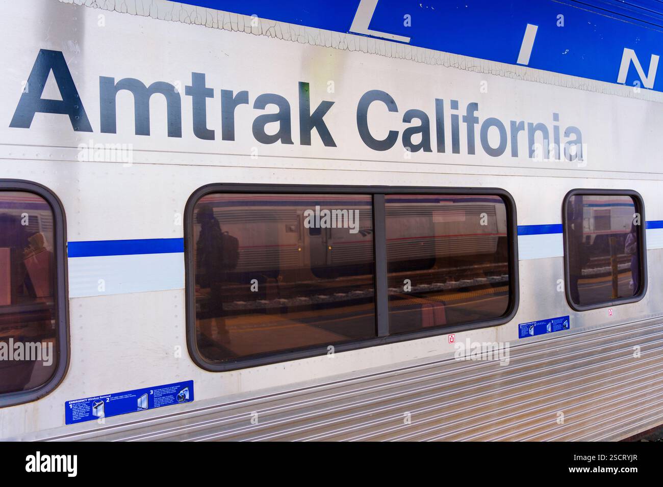 Los Angeles, California - December 30, 2024: Close-up view of Amtrak California branding on train car at Los Angeles station. Stock Photo