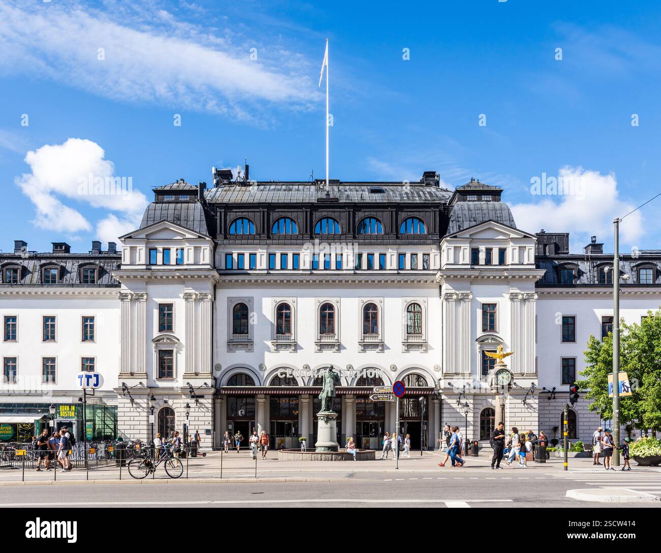 Front view of the Central Station in Stockholm, Sweden, with the statue of Nils Ericson in front of the main entrance, on a sunny summer day. Stock Photo