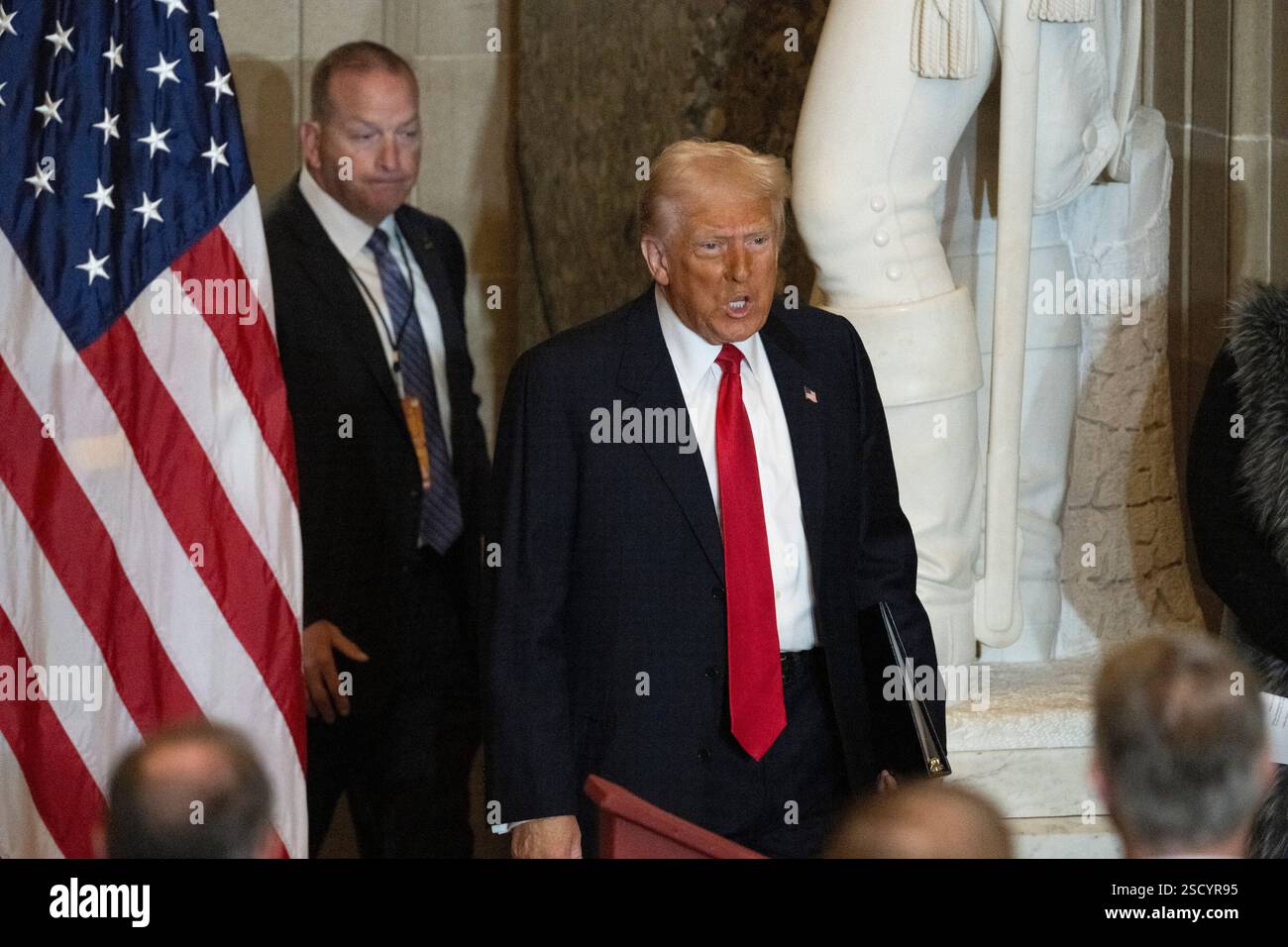 United States President Donald J Trump enters Statuary Hall in the US Capitol in Washington, DC for the National Prayer Breakfast, on Thursday, February 6, 2025. Credit: Mattie Neretin/CNP Stock Photo