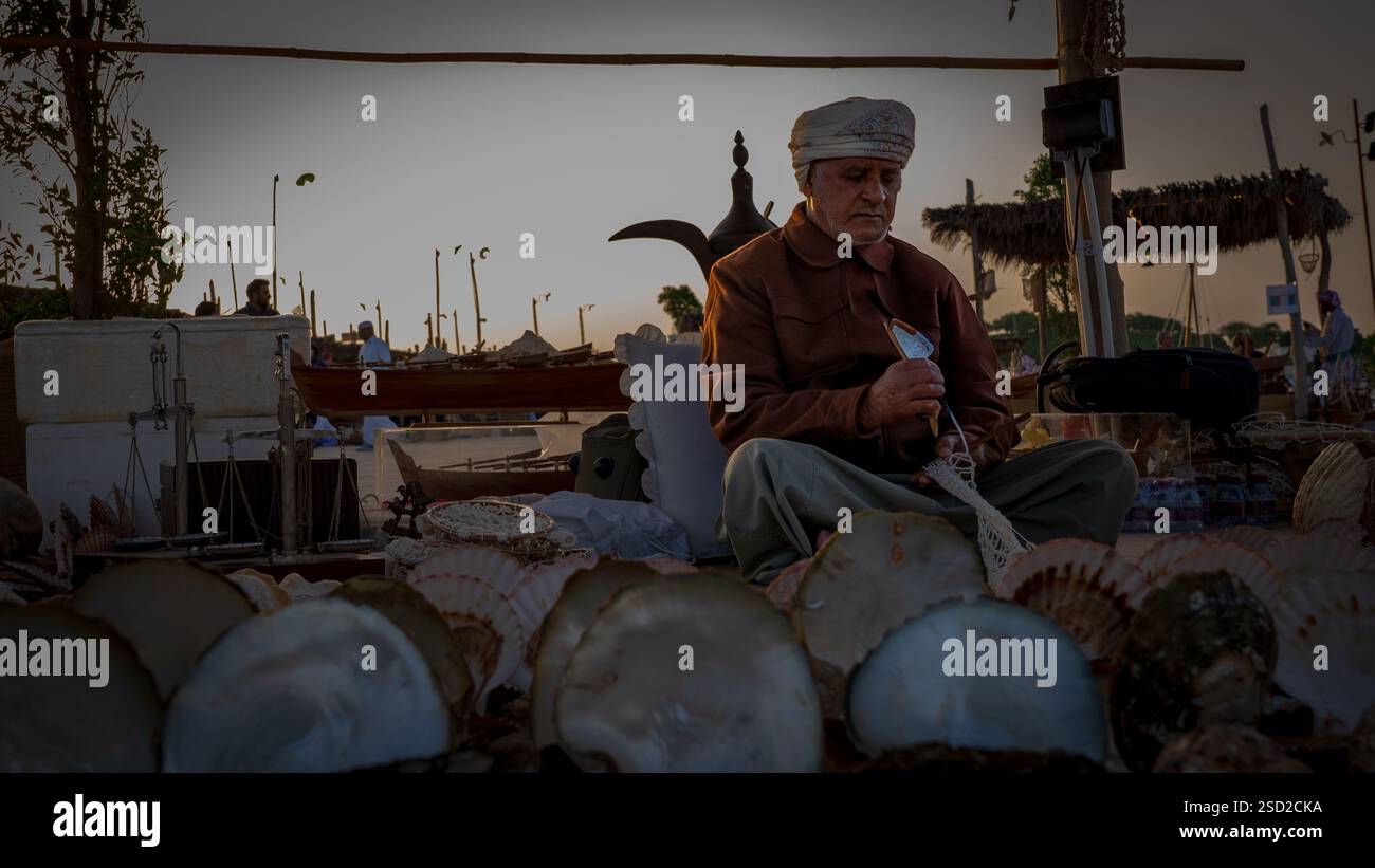 Qatar Shell Instrument Doha,qatar -February 7, 2025: A merchant displaying sea shells and ...