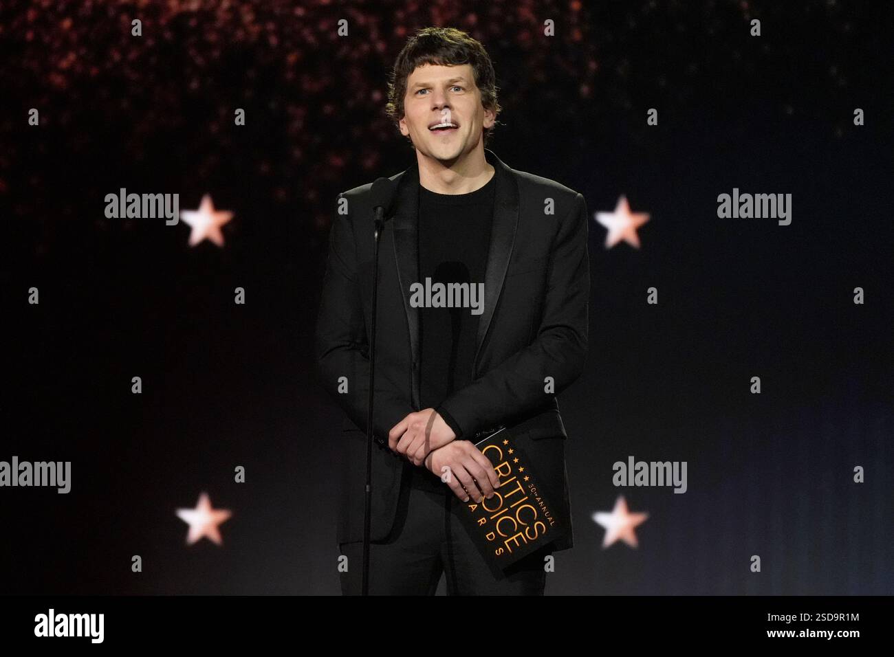 Jesse Eisenberg presents the award for best supporting actress during