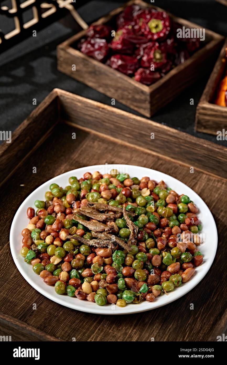 Crispy fried green beans, peanuts and dried fish with salt Stock Photo ...