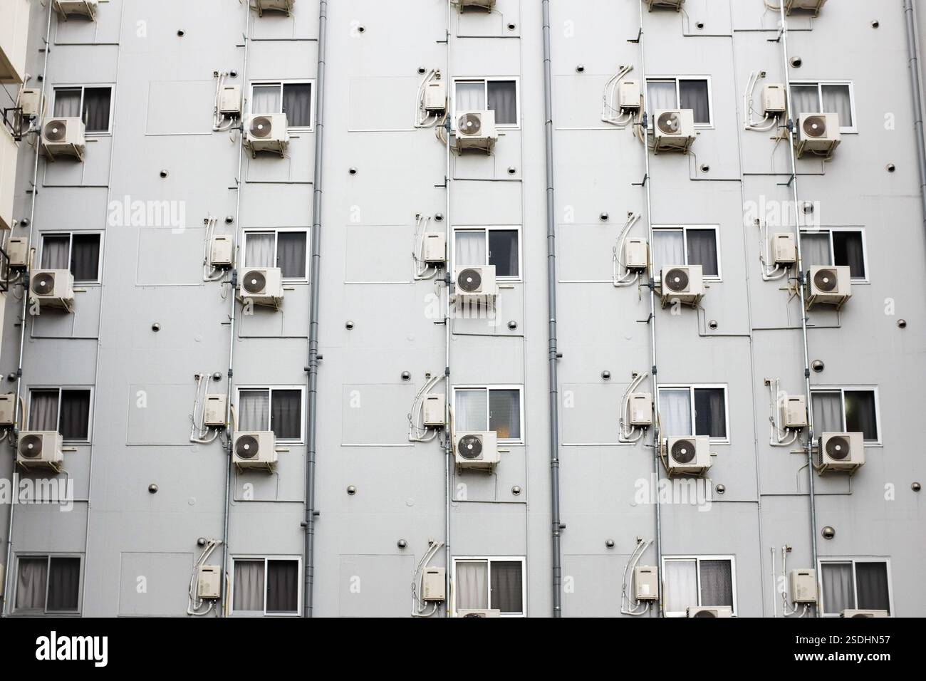 A large number of air conditioning units on a building in Osaka, Japan. Stock Photo