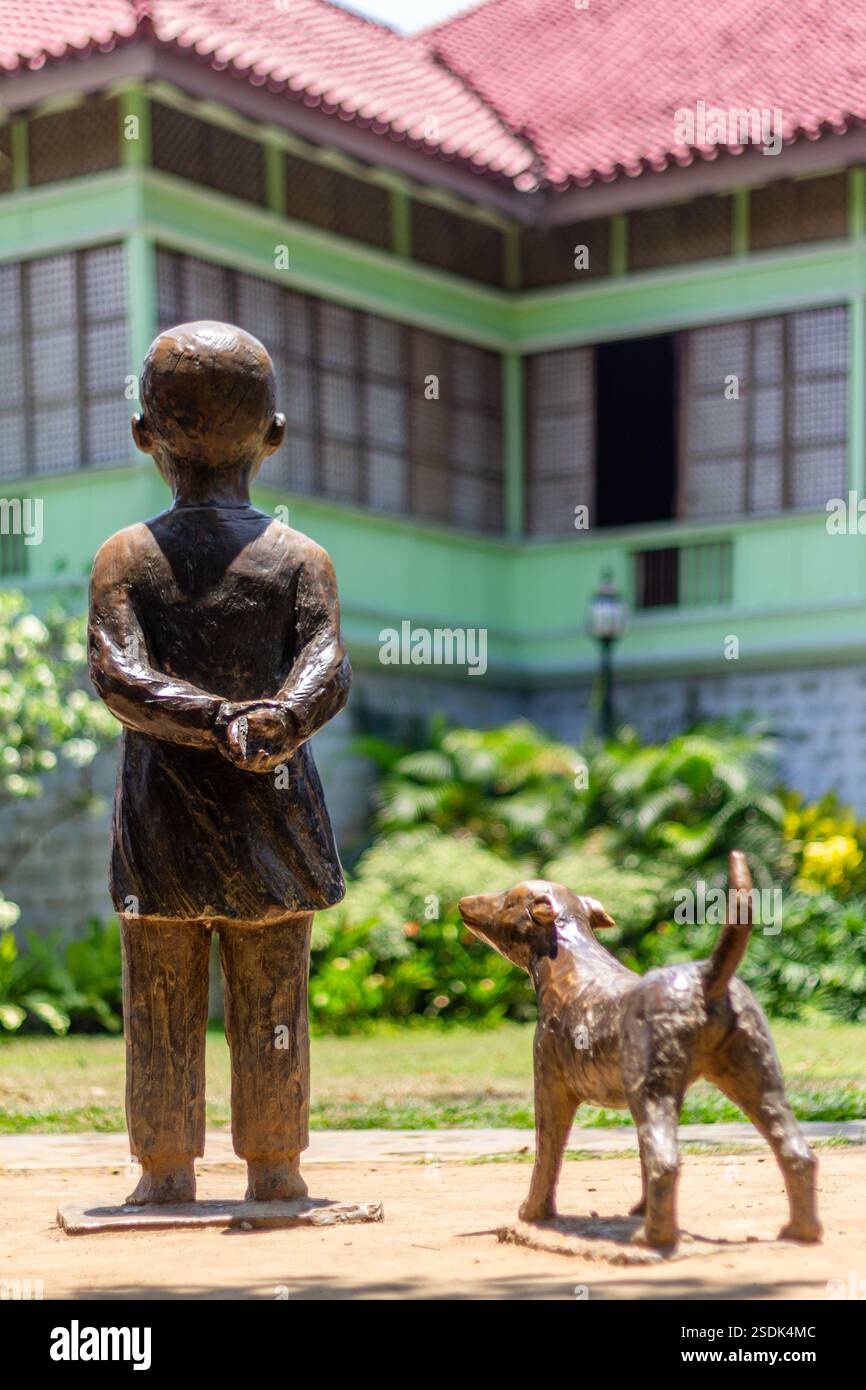 A bronze statue of young Jose Rizal with his pet dog at the Rizal ...