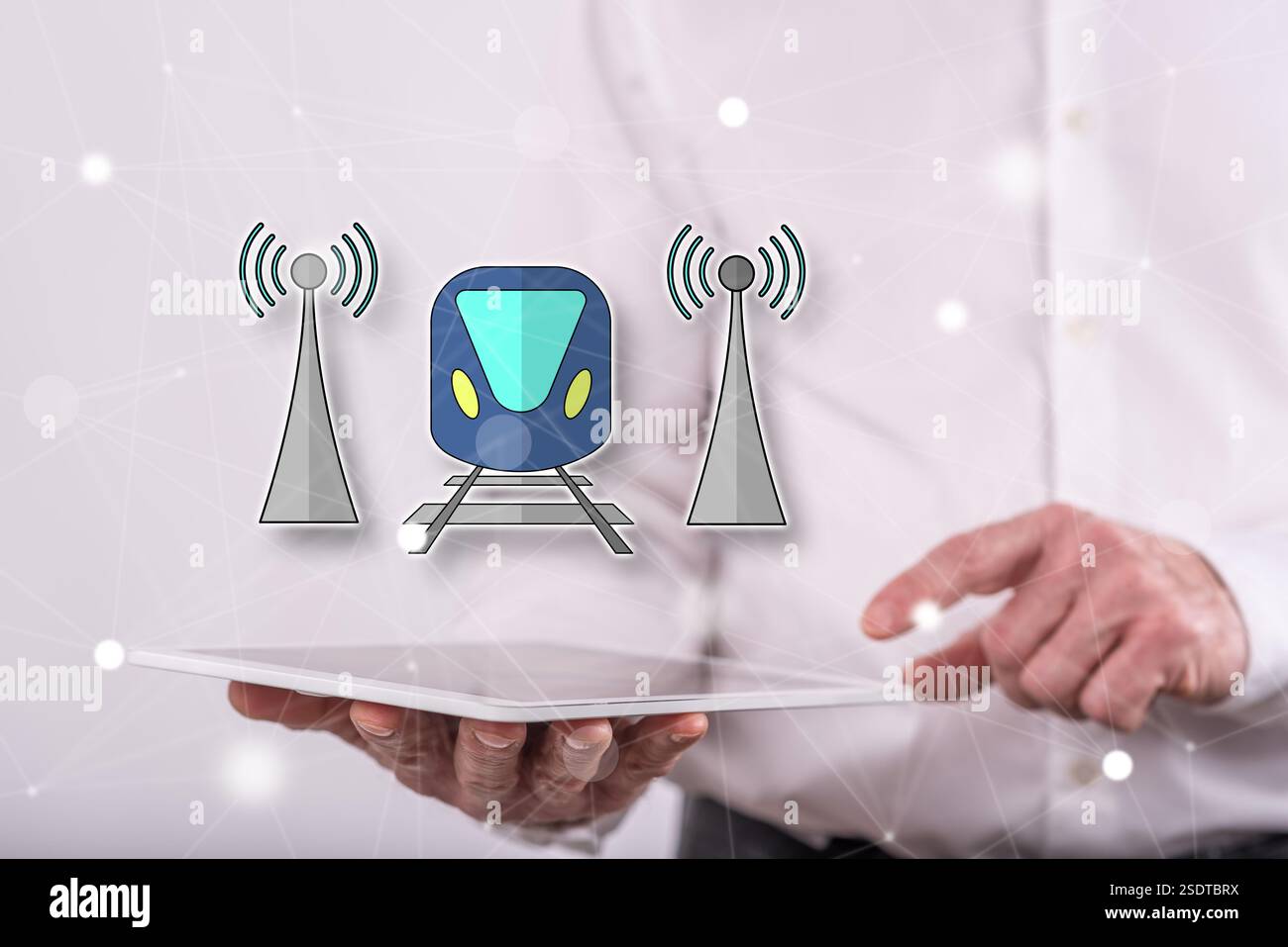 Smart train concept above a tablet held by a man in background Stock Photo