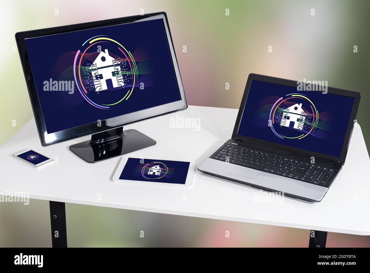 Smart home concept shown on different information technology devices Stock Photo