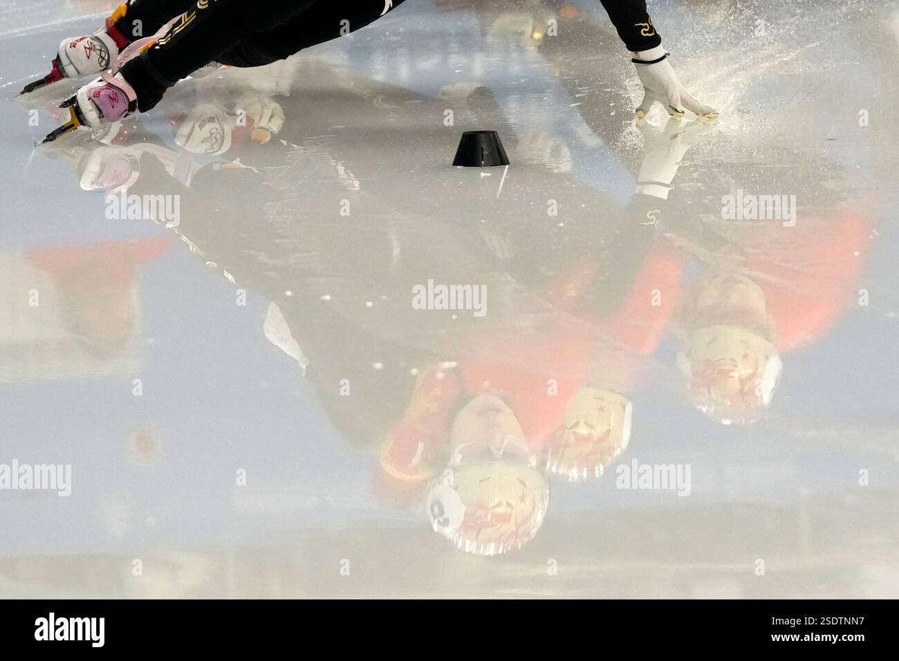 Jing Ru Yang China's Yang Jingru, left, and other athletes are reflected on the ice ...