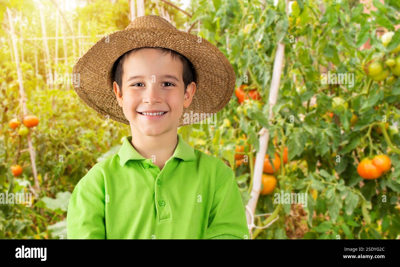 Portrait of a happy farm boy posing in a tomato orchard Stock Photo - Alamy