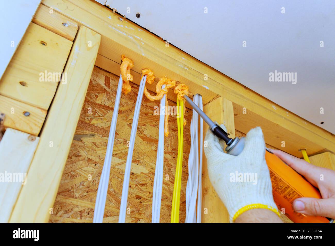 Applying insulation foam to prevent drafts improve energy efficiency in