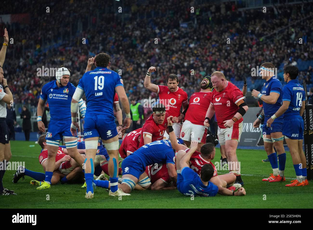 Wales' players celebrate after Wale's Aaron Wainwright, unseen, scored ...