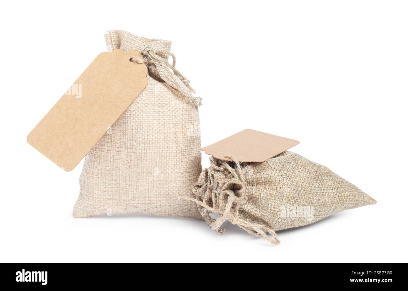 Burlap bags with tags isolated on white Stock Photo