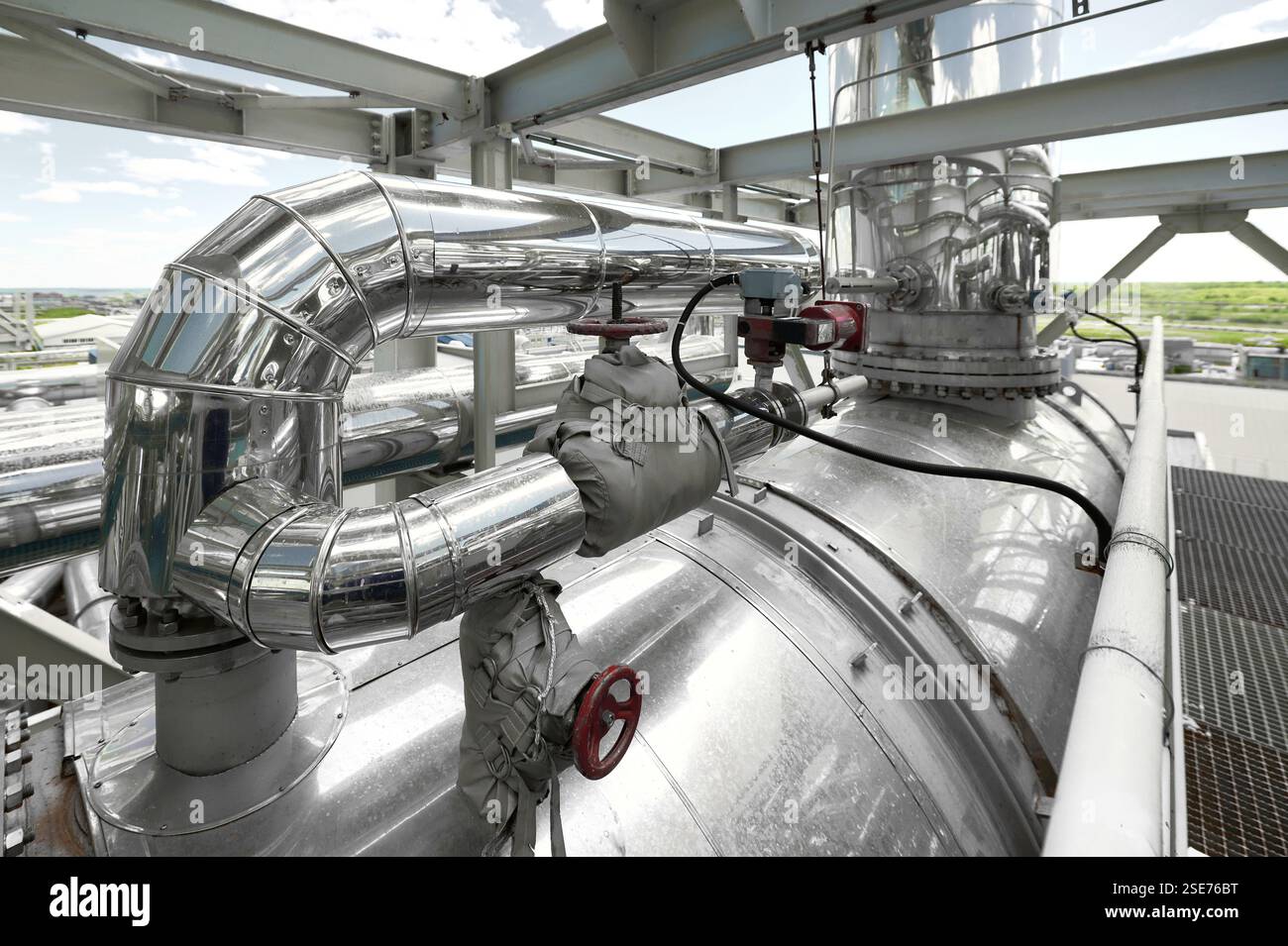 Tank Operation Examples Detailed view of stainless steel pipelines and tanks in a chemical ...