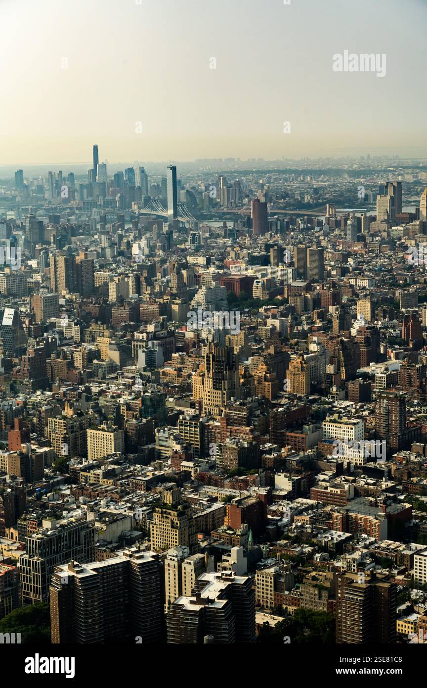 Image showcasing A sprawling city is laid out below with numerous buildings and ...