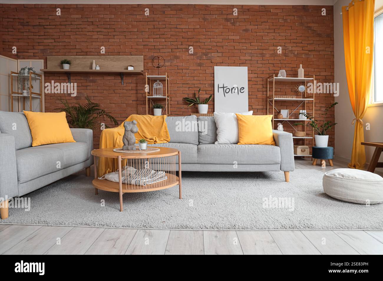 Interior of living room with cozy sofas, coffee table and pouf Stock ...