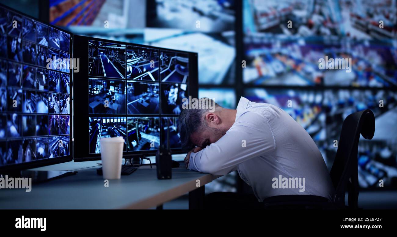 Security System CCTV Camera Operator Using Computer Monitor Stock Photo
