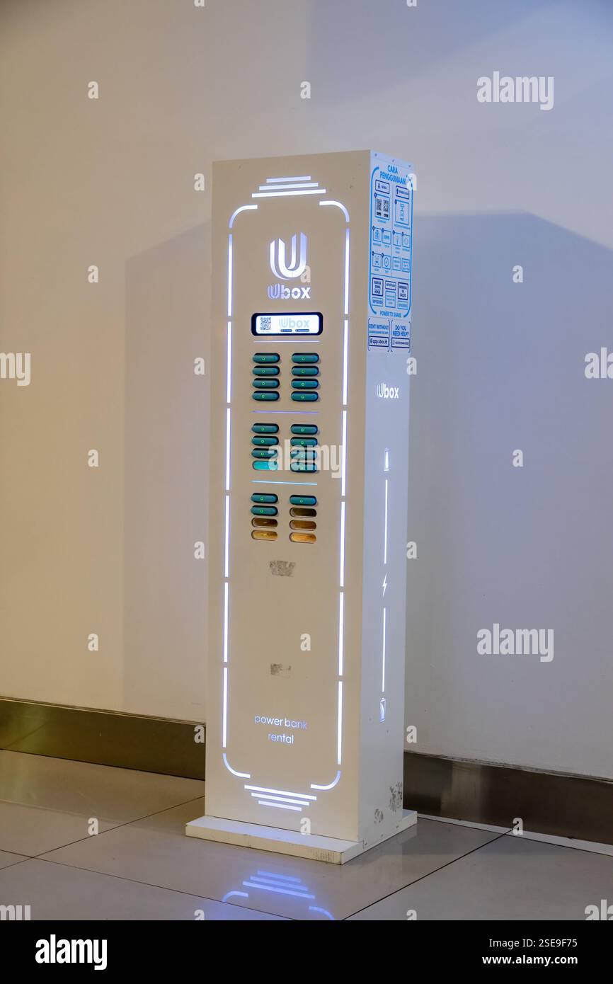 Modern power bank rental station with illuminated design, multiple charging  slots, and a digital interface in a public area, Jakarta Airport, Indonesi  Stock Photo - Alamy