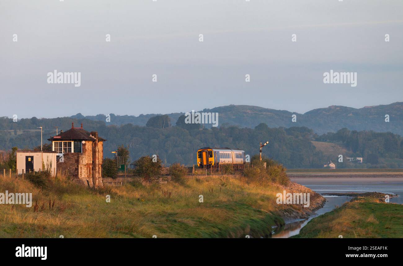 Northern Rail class 156 sprinter train passing Arnside signalbox on the ...