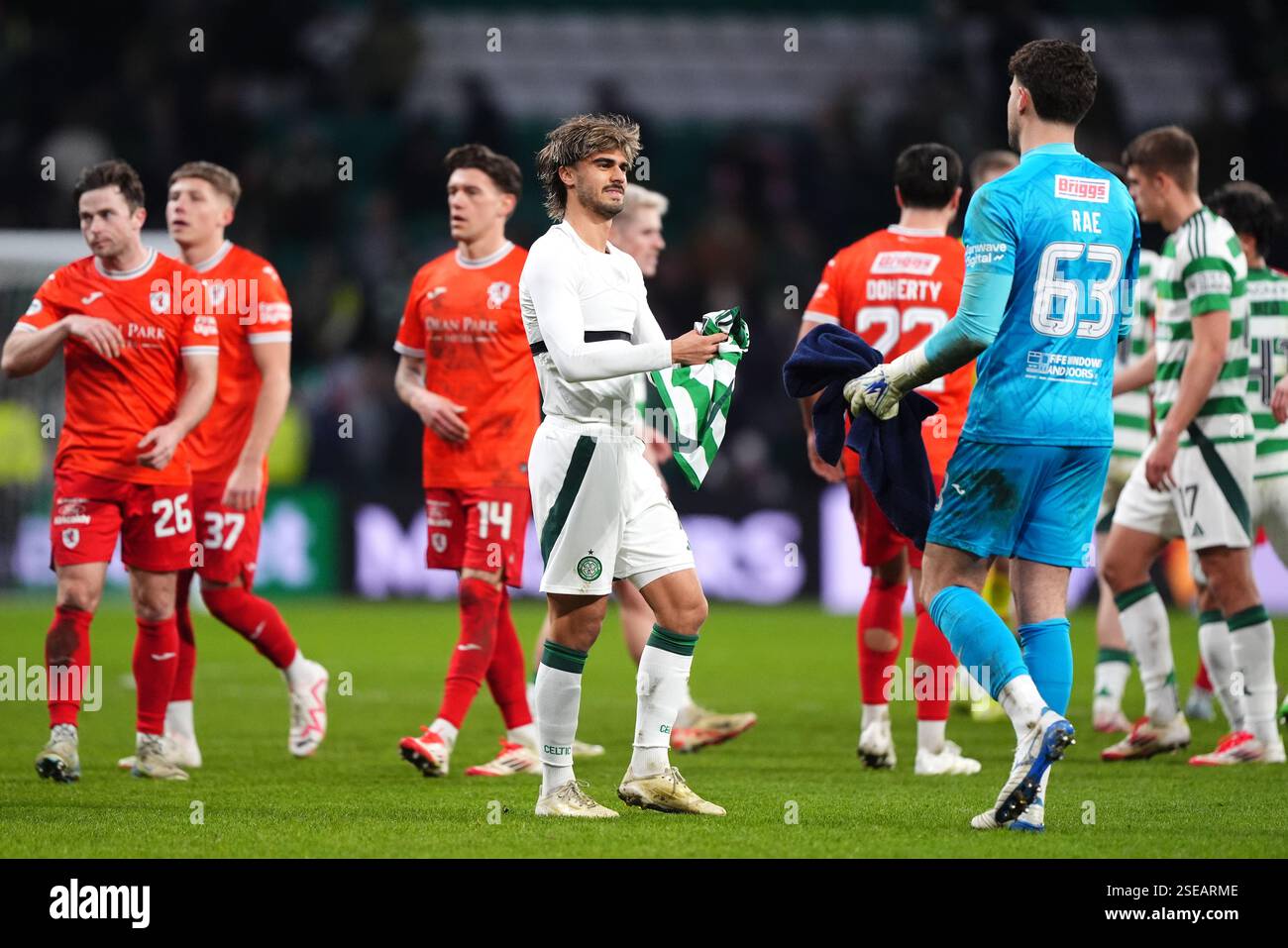 Joshua Rae Celtic's Jota (centre) and Raith Rovers goalkeeper Josh Rae after the ...