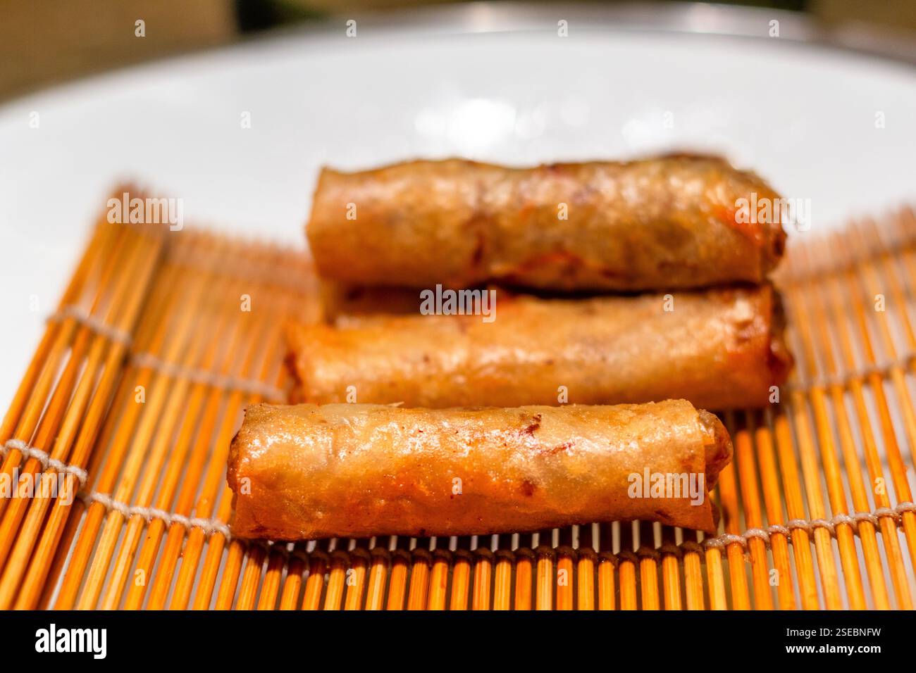 Fried lumpia, a popular Filipino street food, served at a local restaurant in Cebu, Philippines Stock Photo