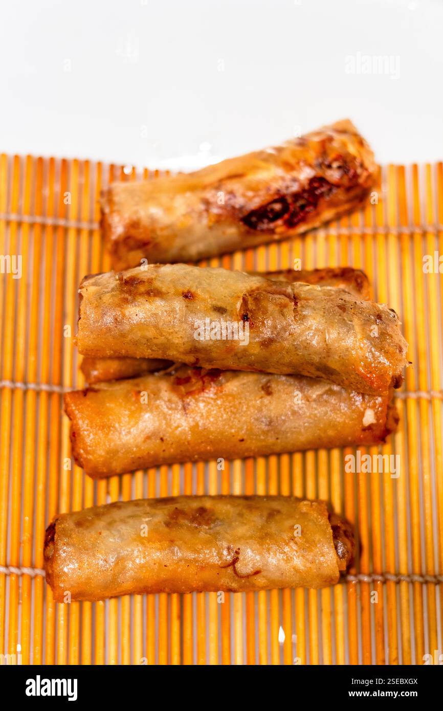 Fried lumpia, a popular Filipino street food, served at a local restaurant in Cebu, Philippines Stock Photo